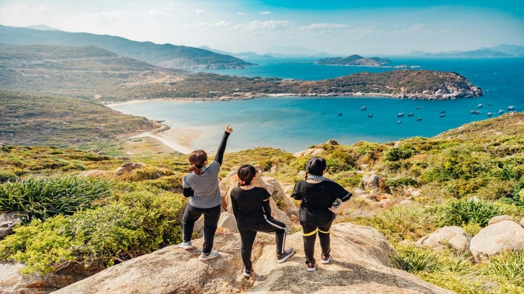 Three women on top of a mountain