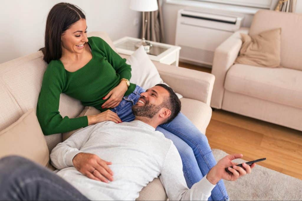A man laying his head on a woman’s lap