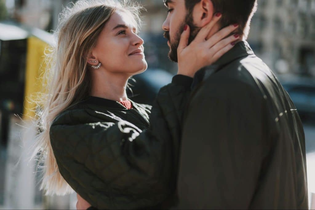 A man and woman facing each other