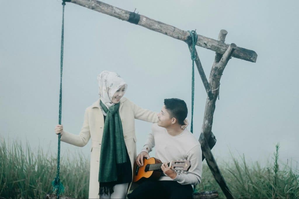 A man singing a song to a woman.