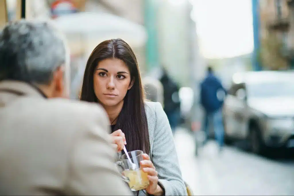 A woman asking a man.
