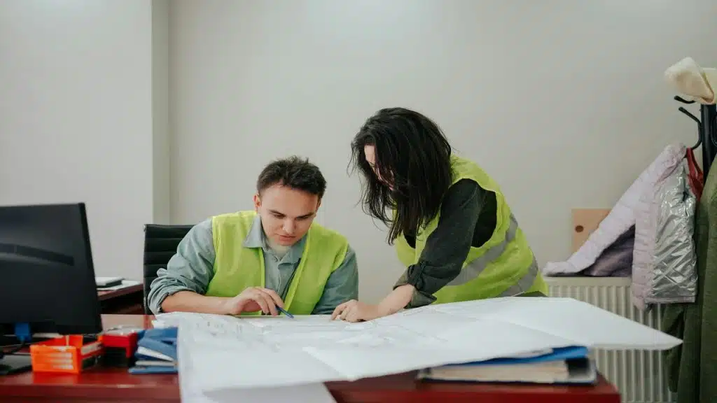 Colleagues helping each other