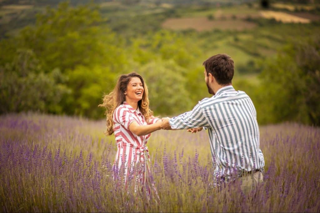 A man and woman at the grass field