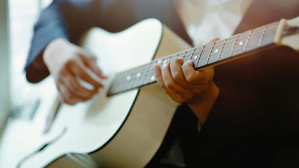 A person playing a guitar.