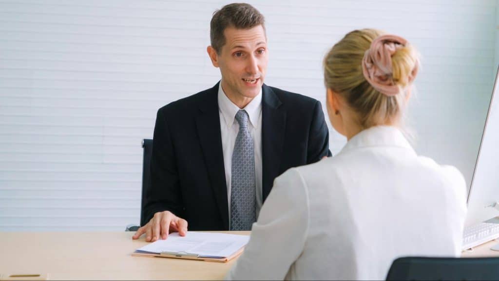 A man looking happy while at the job interview.