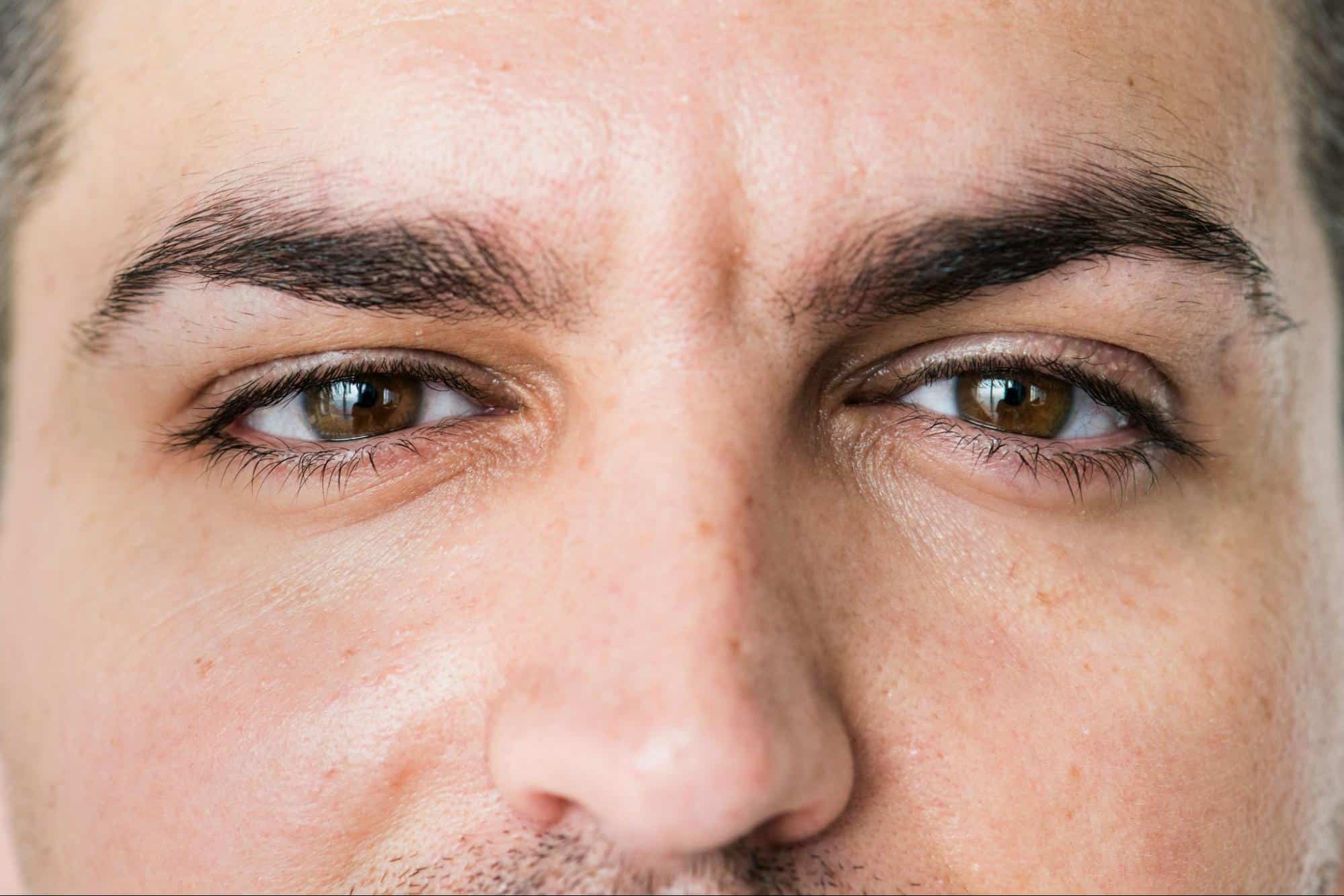 A close-up picture of a man including eyebrows.