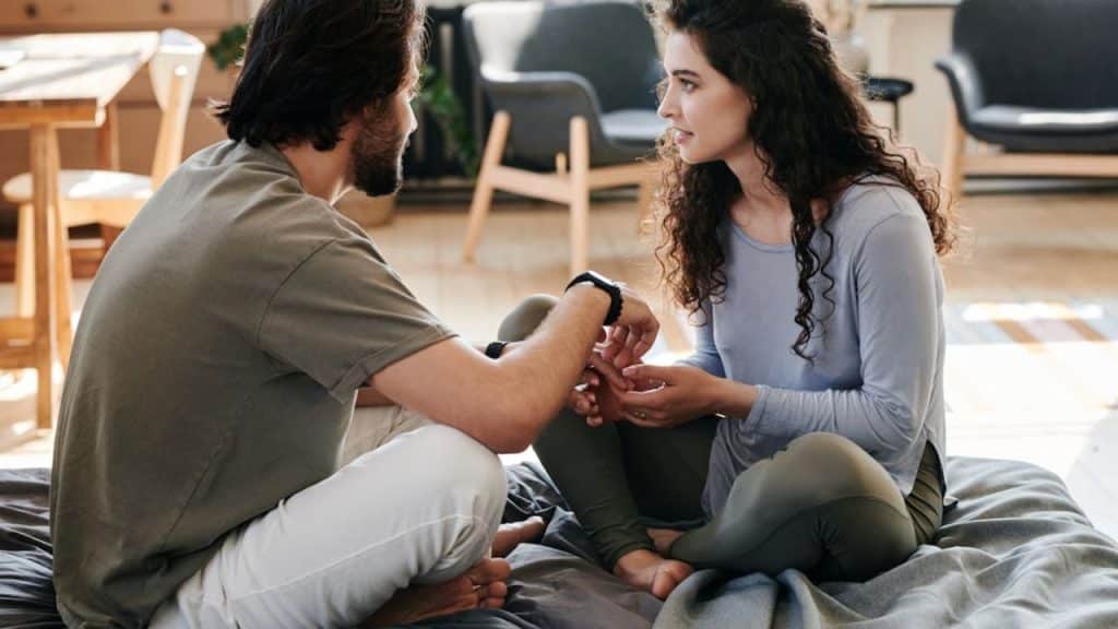 A man attentively listening to a woman during a meaningful conversation