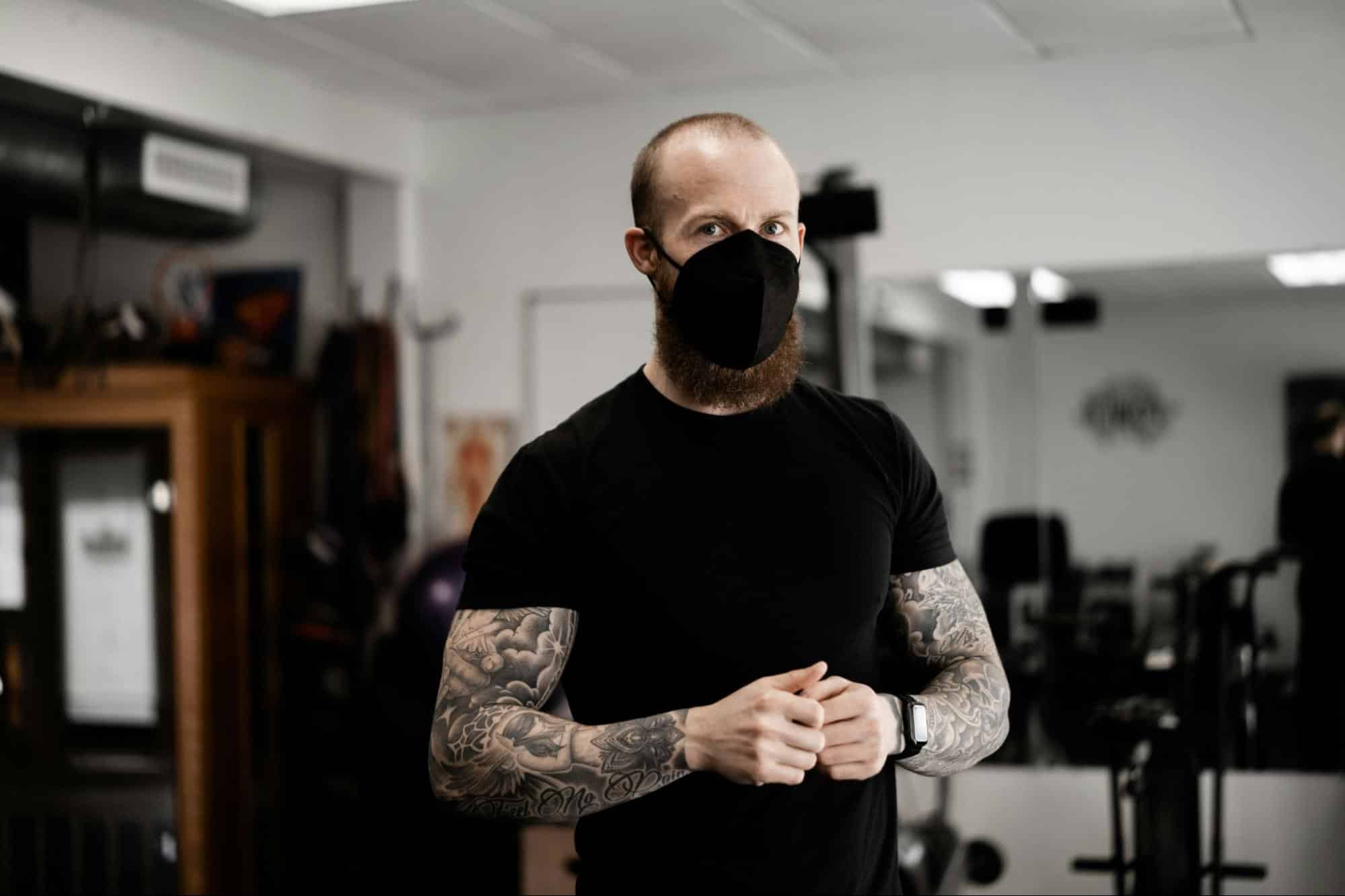 A man wearing a mask looking healthy.