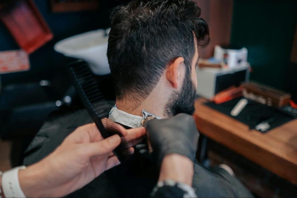 A man getting his haircut.