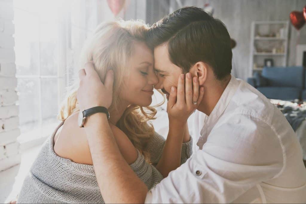 A man and woman being close together