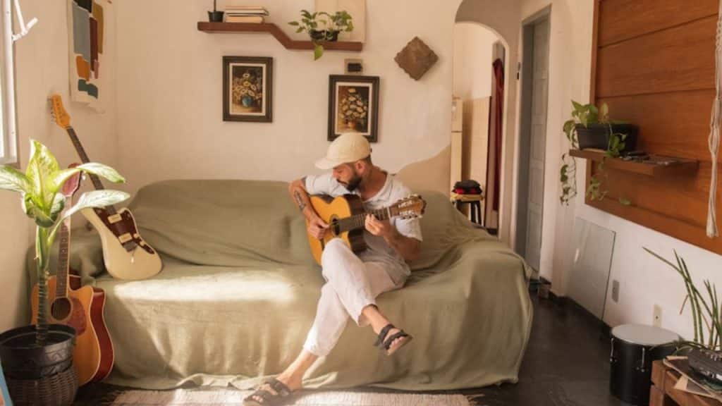 A man revisiting an old hobby in his workspace