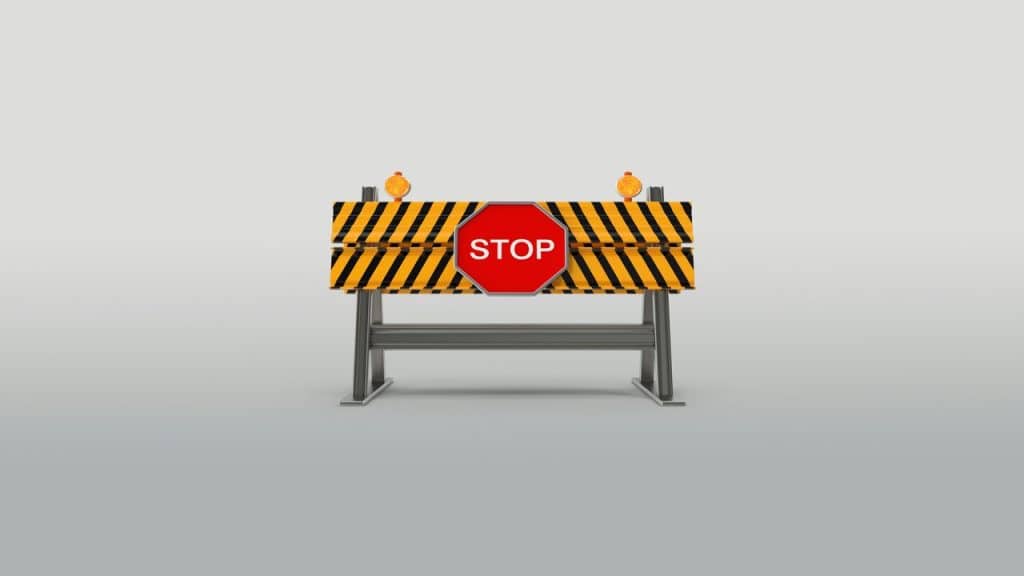 A stop sign on a metal stand