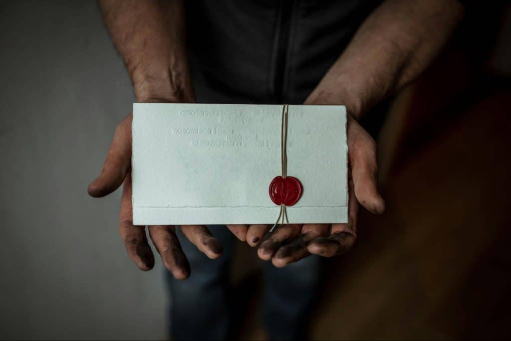 A man made a hand written letter for a woman