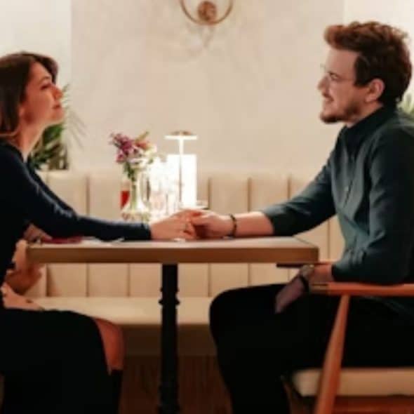 Couple having a focused conversation without devices.