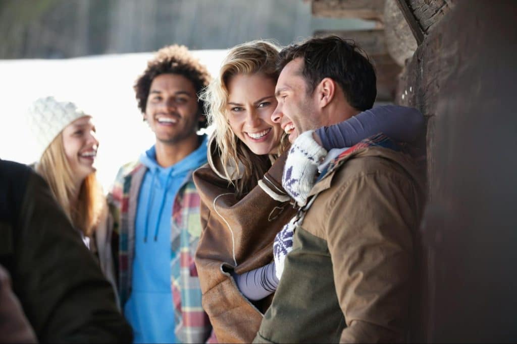 A husband and wife happy with their friends