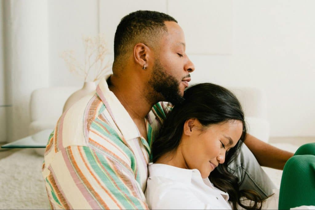 A man hugging a woman