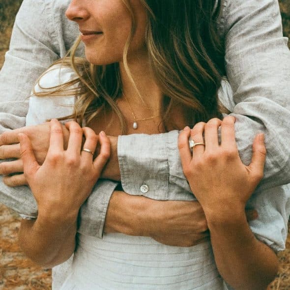 A man hugging a woman 