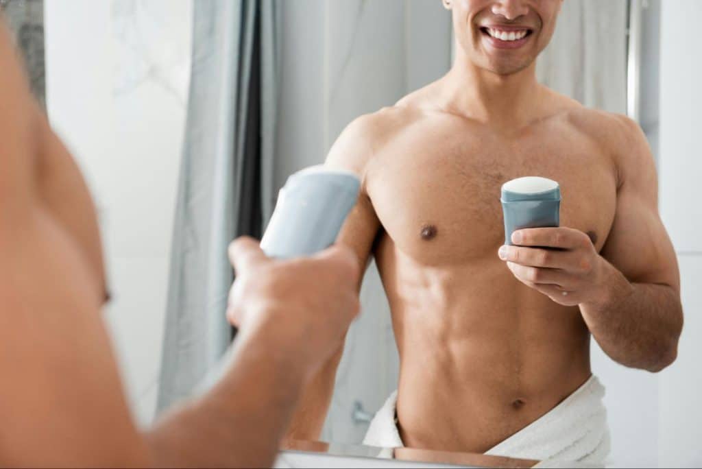 A man holding a deodorant.