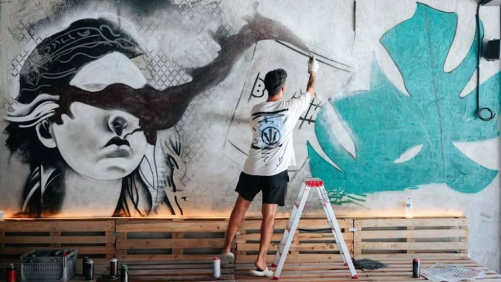 A man working passionately on a creative solo project