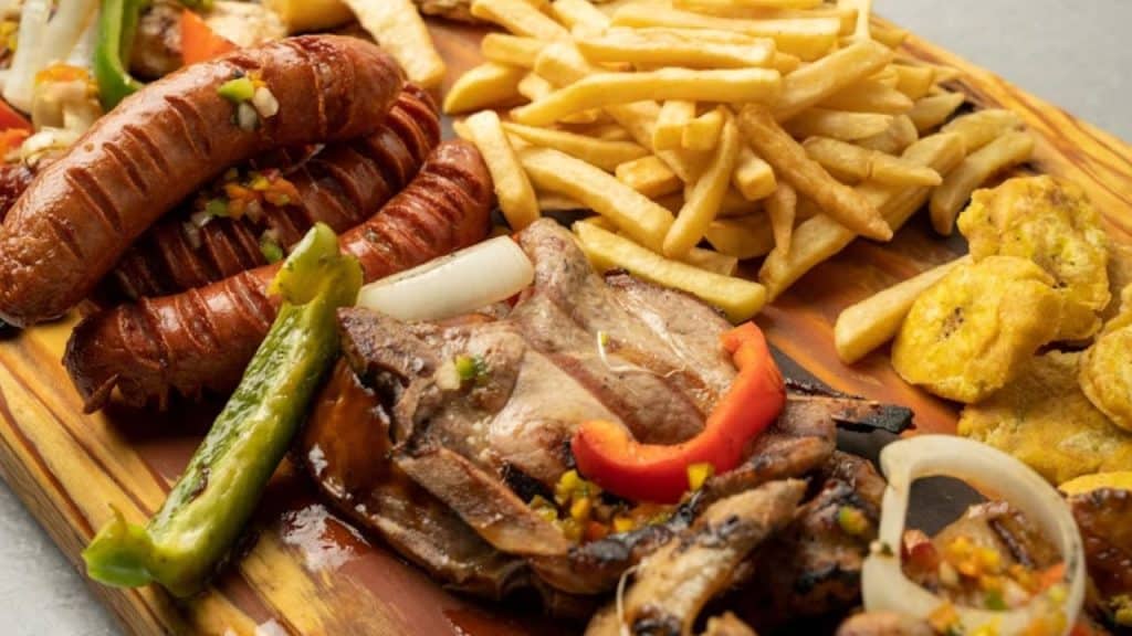 Overloaded plate of protein heavy food.