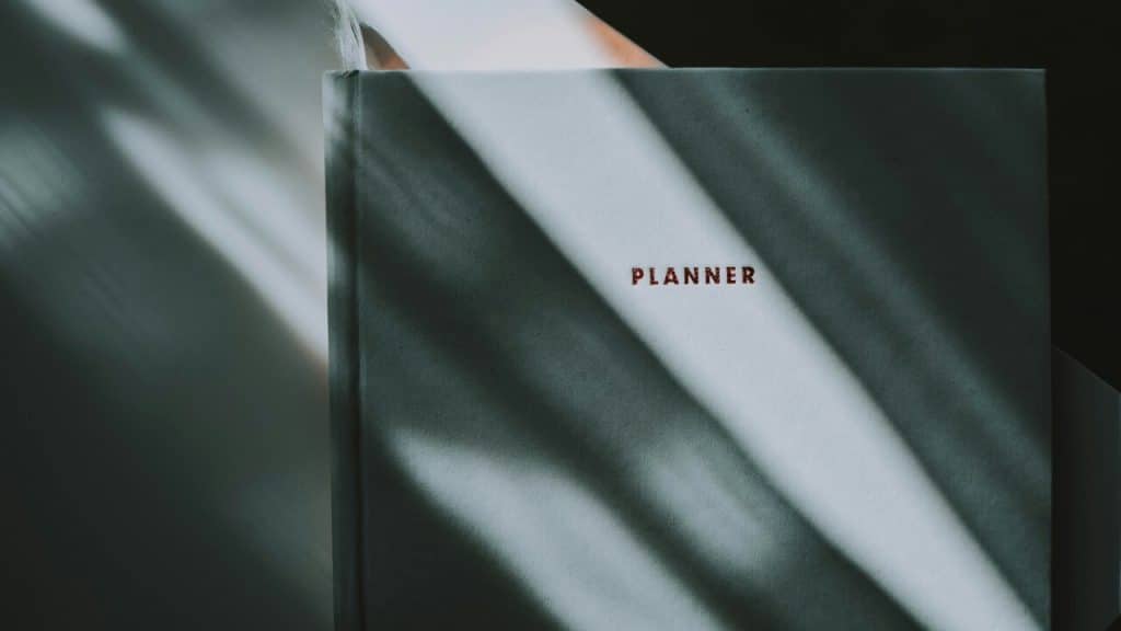 A notebook with the word “planner” on it