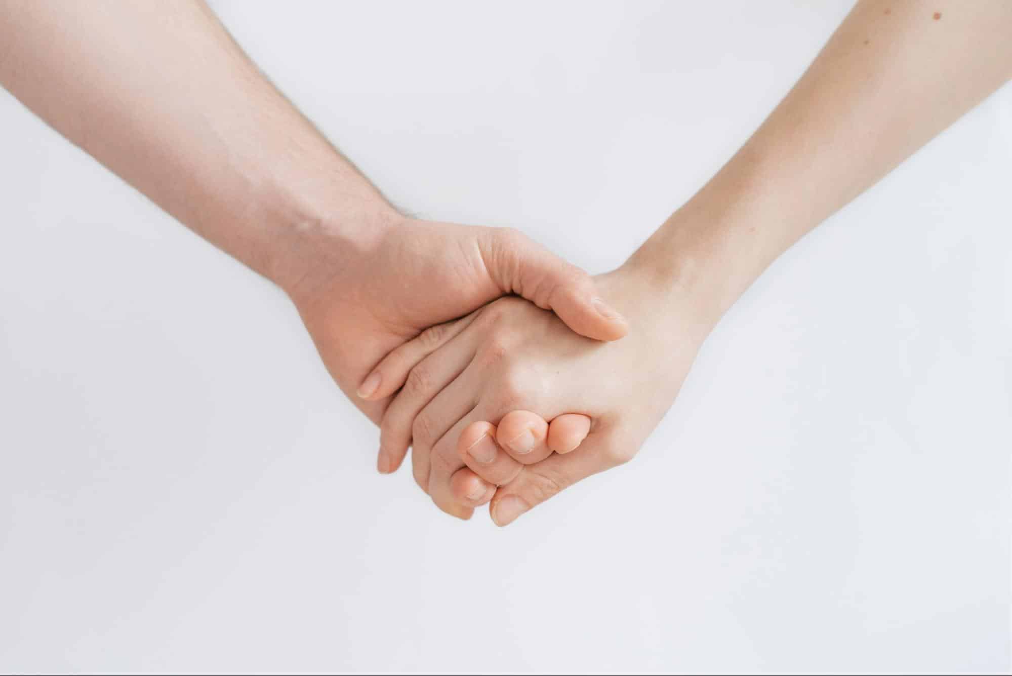 A man and woman holding hands.