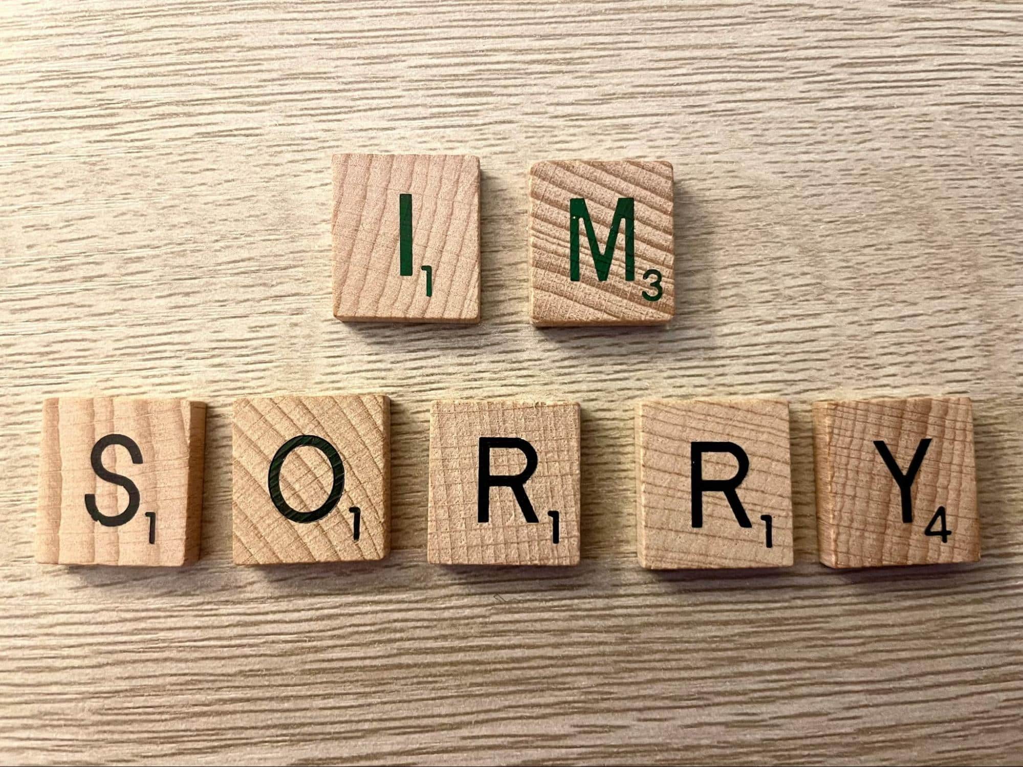 A scrabble letters that says “i’m sorry”.