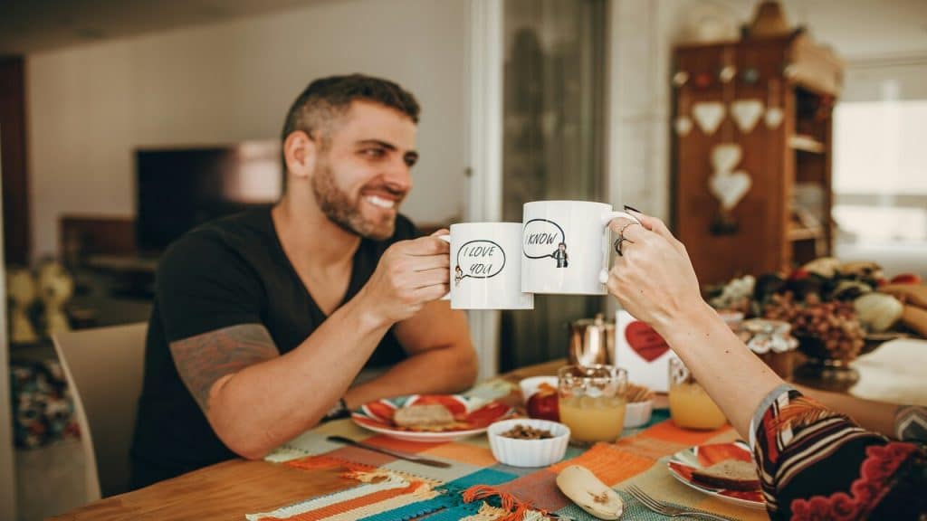 A couple sharing a meal at home