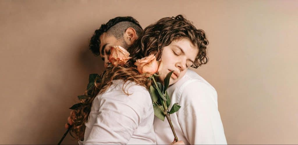 A man and woman leaning at each other 