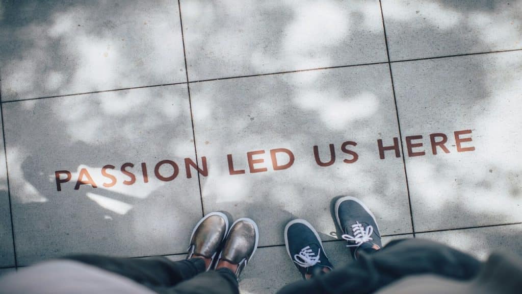 The words “passion led us here” on the floor.