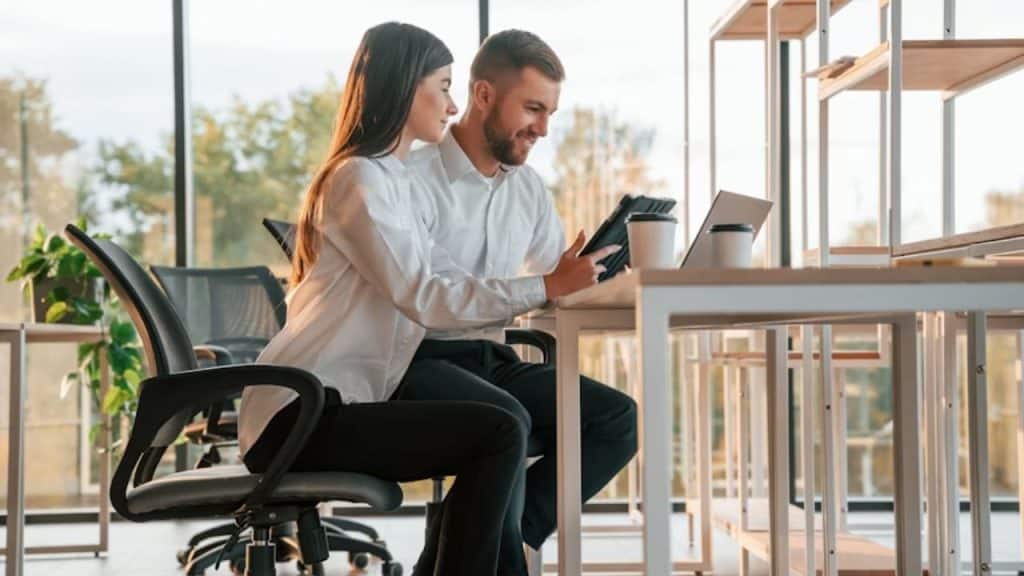 Man and partner planning something on a calendar or notebook