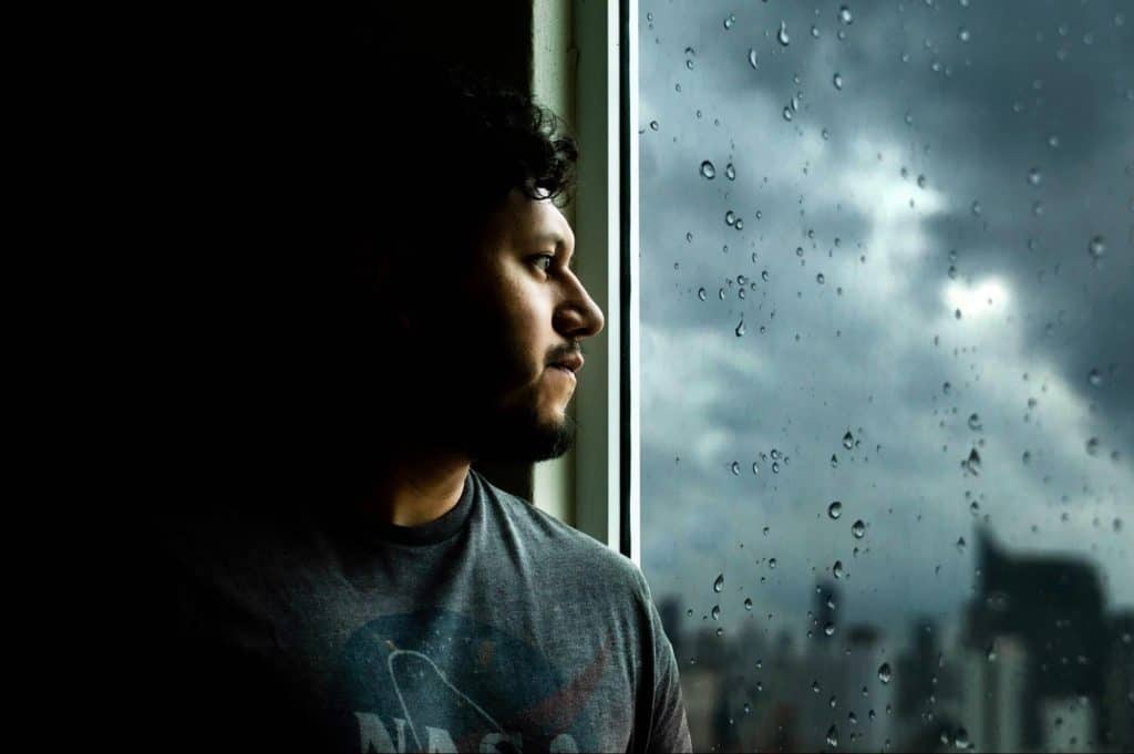 A man looking outside the window