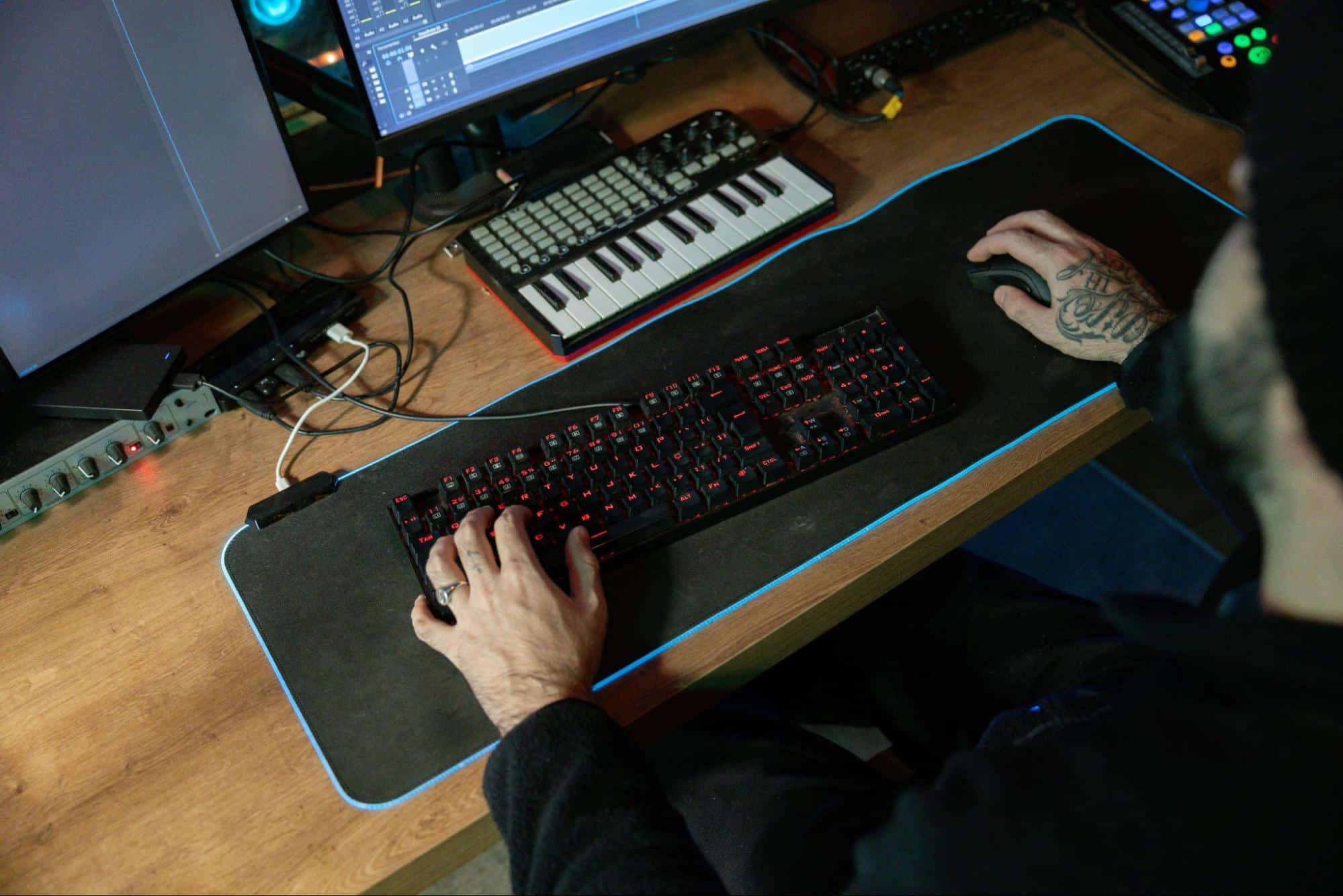 A man using his keyboard and mouse.