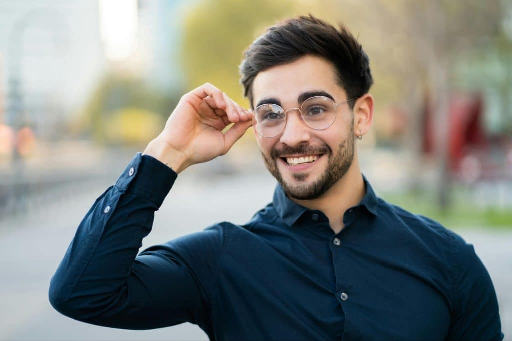 A man smiling and looking confident.