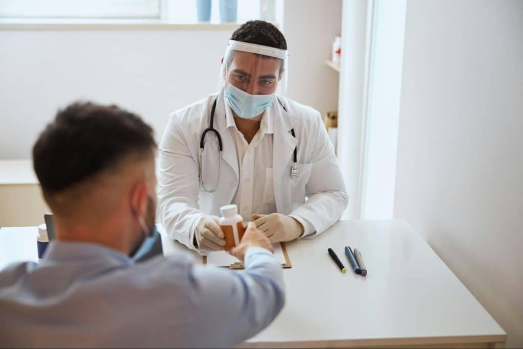 A man consulting a doctor