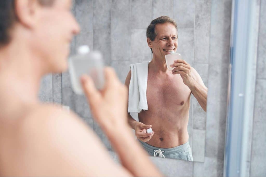 A man smelling his toner.
