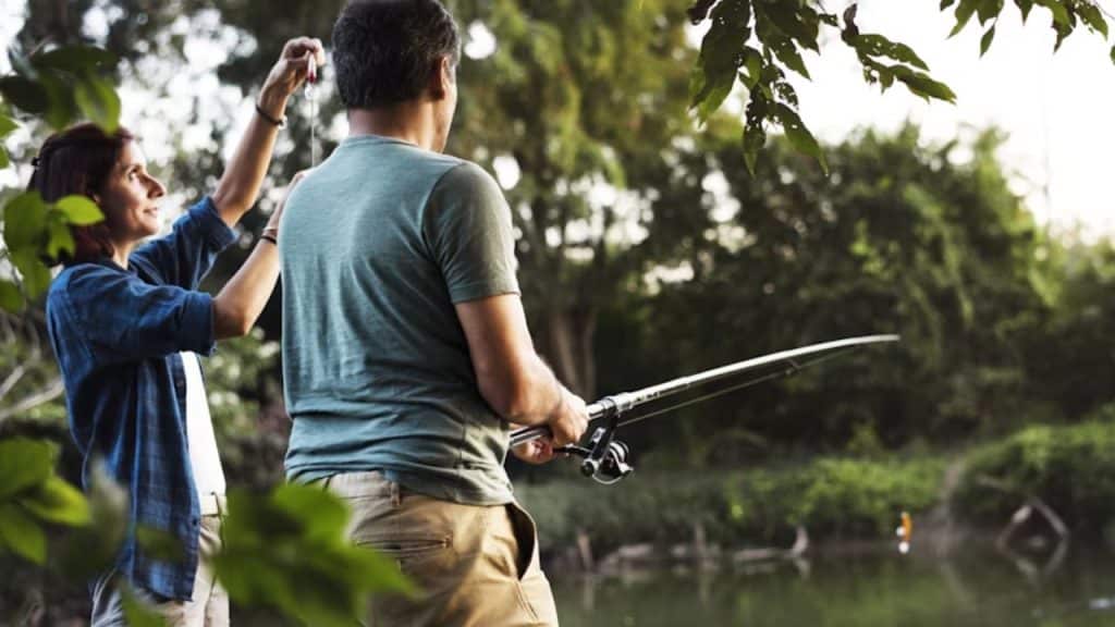 Couple trying fishing  for the first time together.