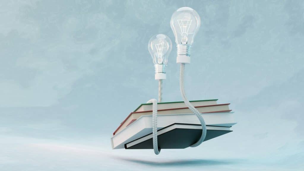 Light bulbs attached to books