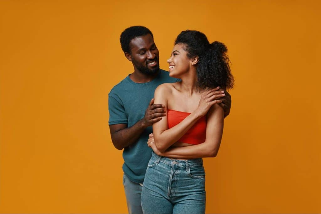 A man encouraging a woman to be confident.