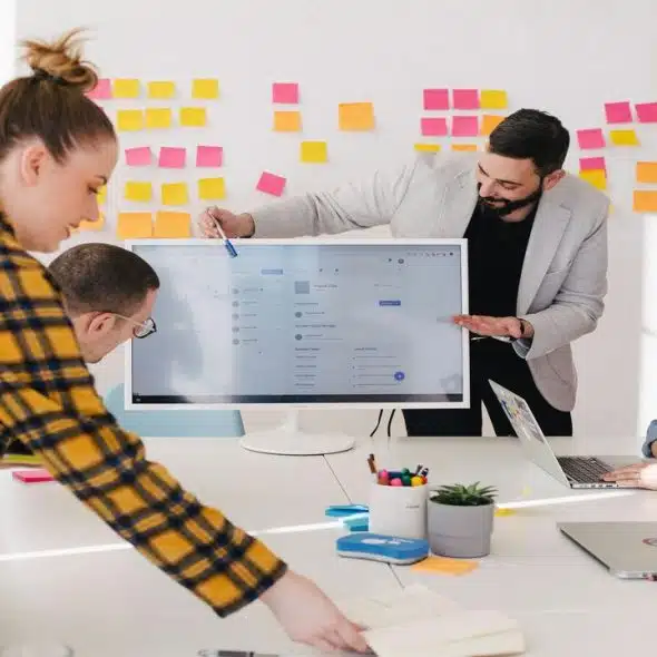 A man leading a business meeting.