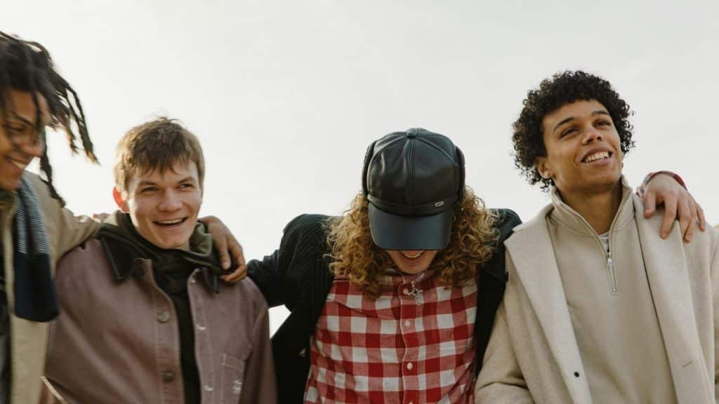 A group of friends with arms around each other.