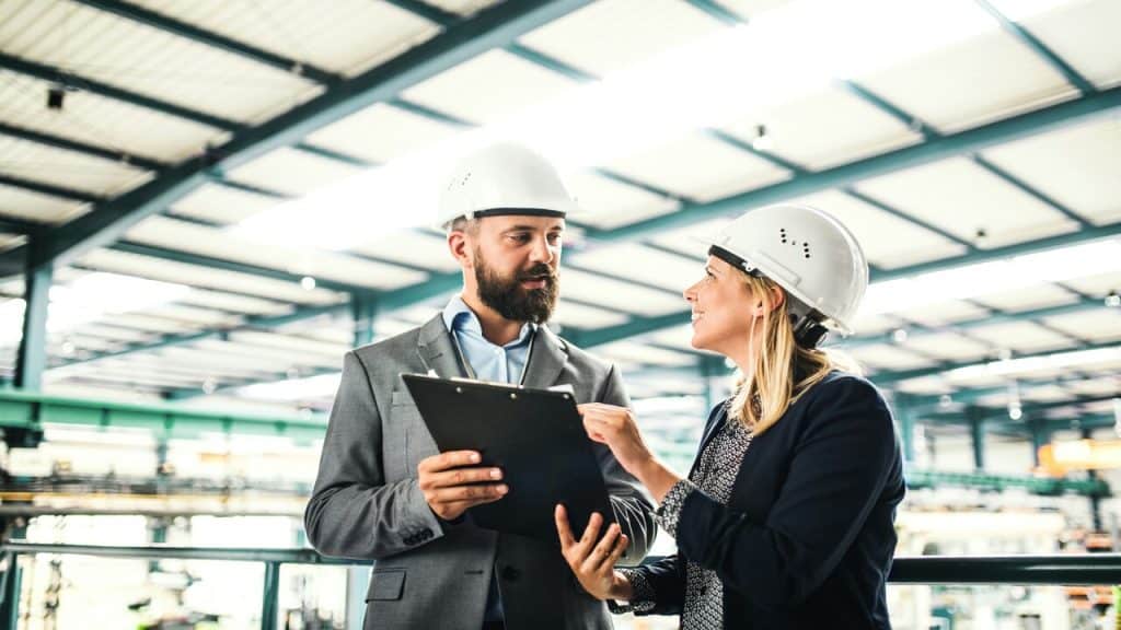 Managers talking at a factory