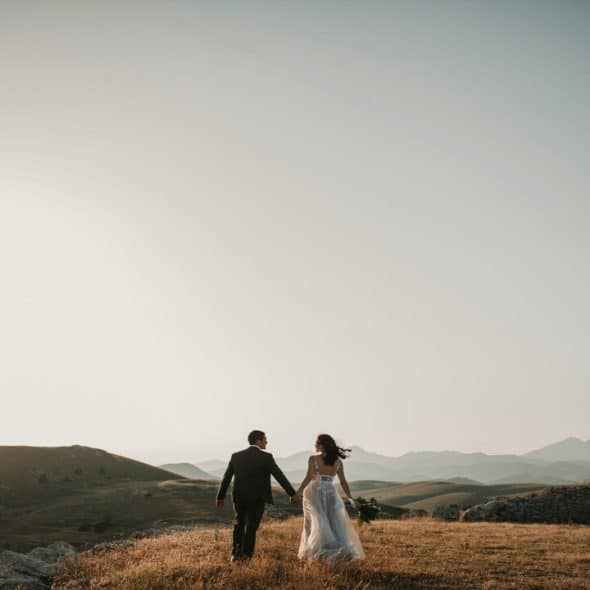 A groom and a bride on a field