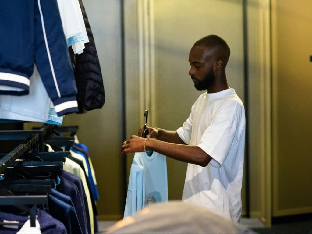 A man choosing clothes.