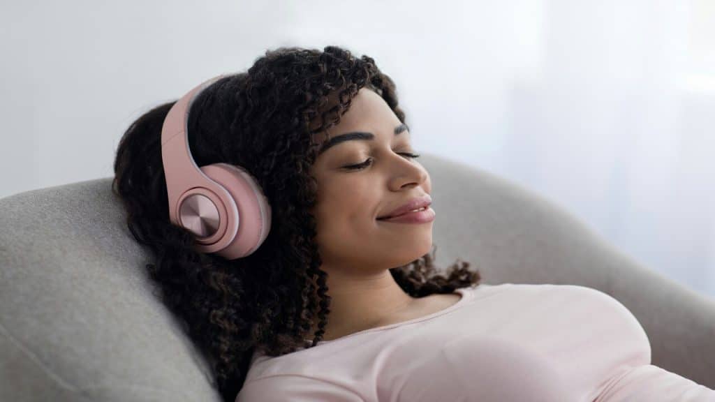 A woman listening to music.