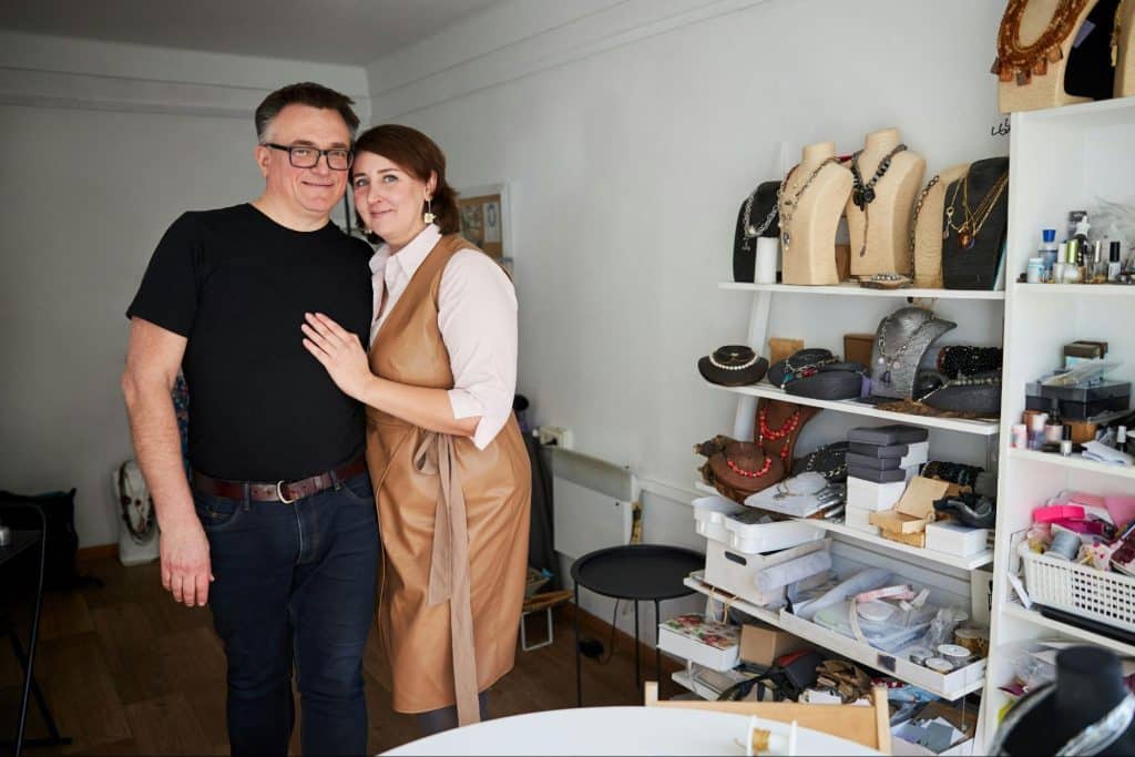 A man and woman beside their organized accesorries