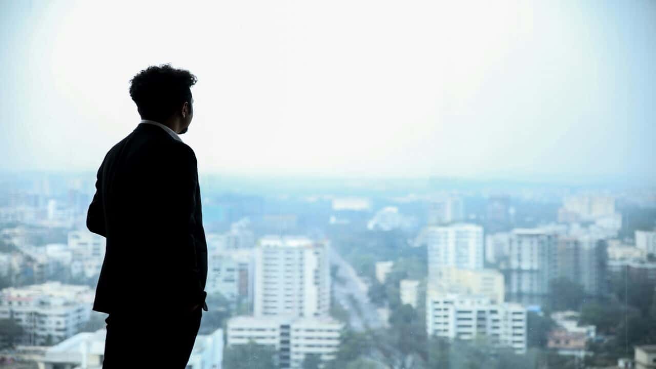 A businessman looking out the window.