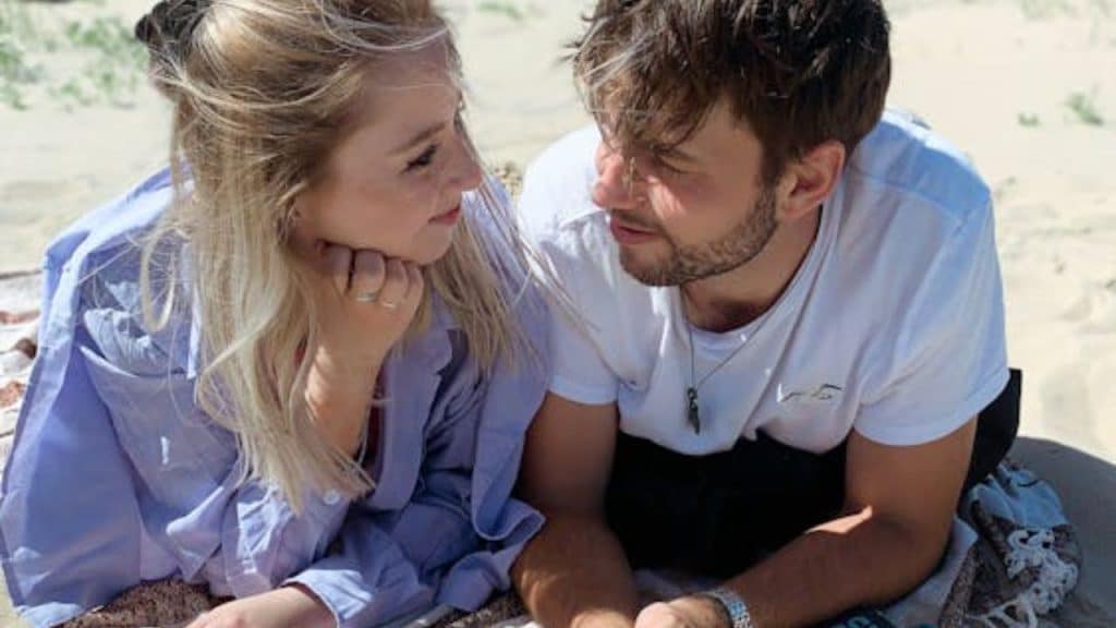 Man reflecting on silent signs of attraction from a woman