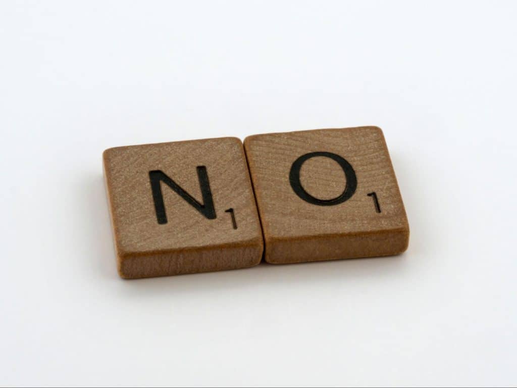 A picture of scrabble letters saying “no”