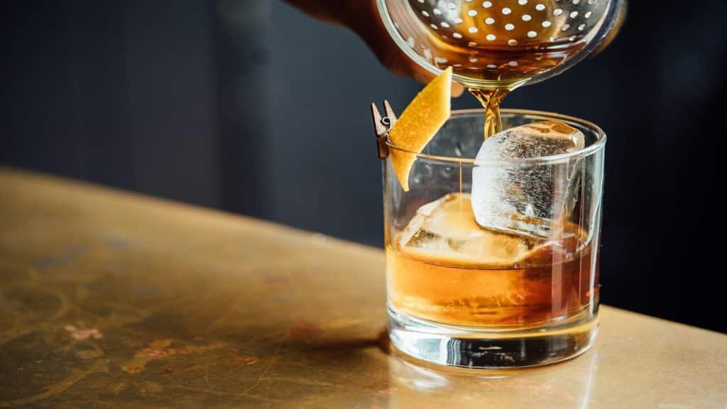 Whiskey being poured on glass